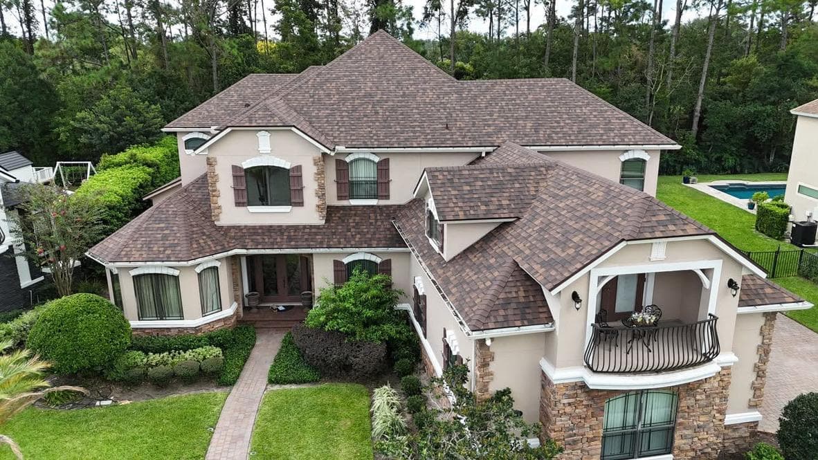 Brown shingle roof on a two-story home