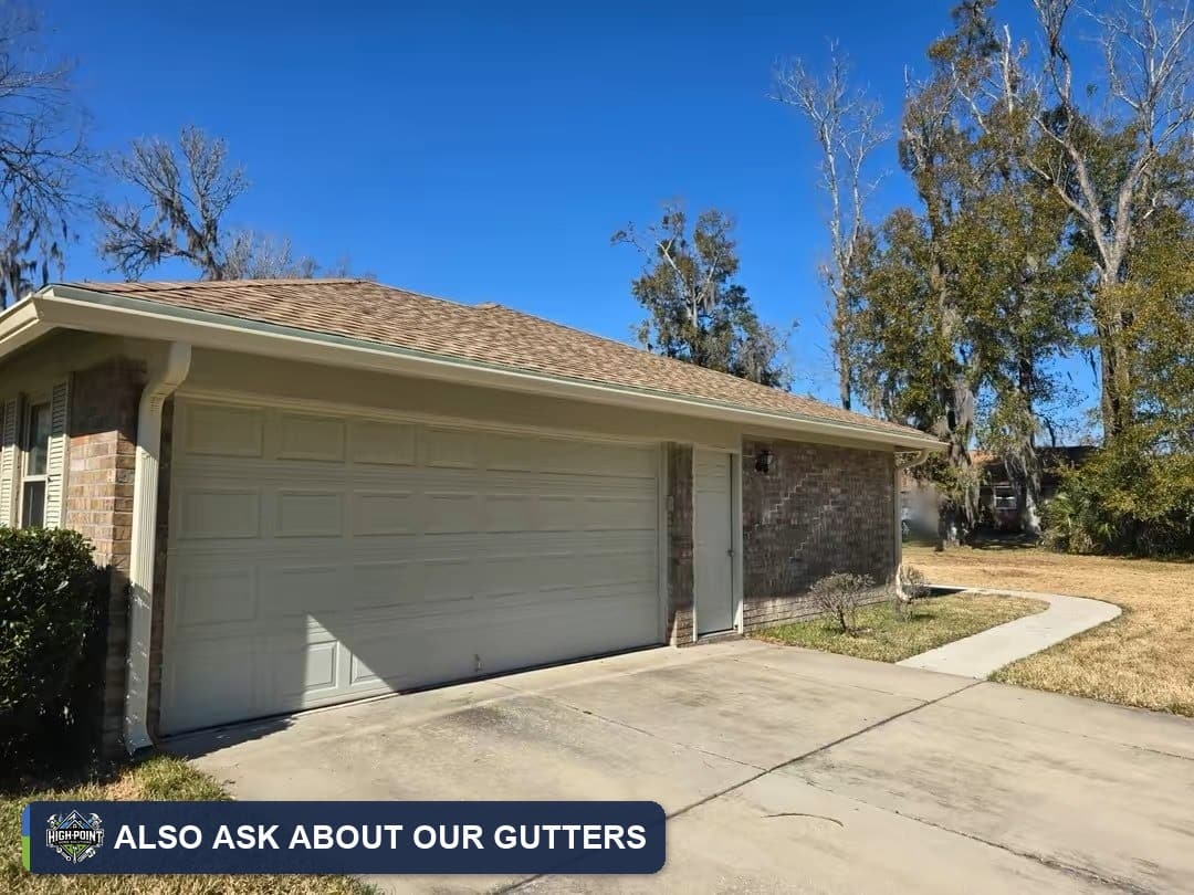 Home with new gutters above the garage